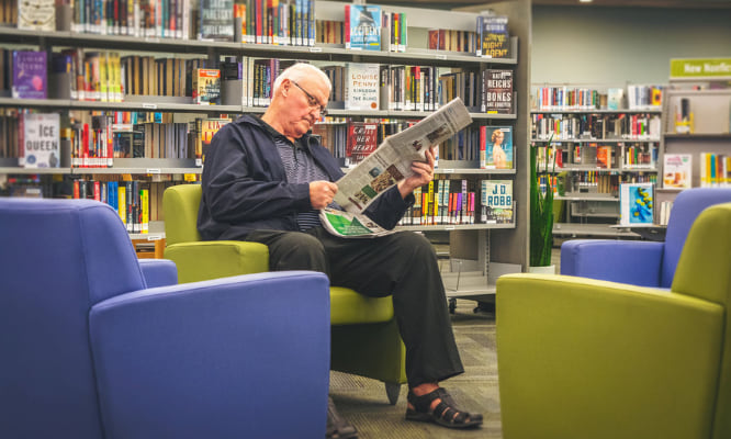 a person reading a newspaper